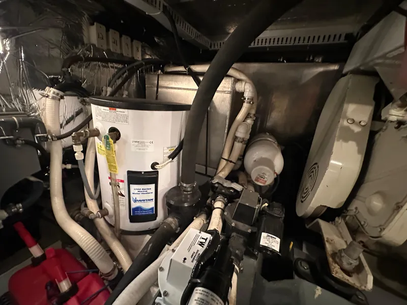 Slide: The Image of Interior of 1995 Carver 440 Aft Cabin Motor Yacht with chairs and entertainment center. - 20