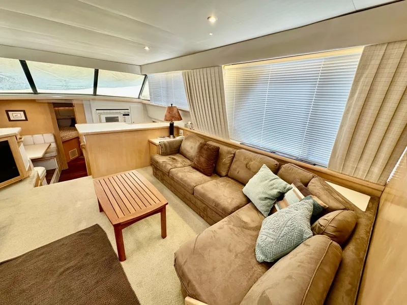 Slide: The Image of Cozy cabin interior of 1995 Carver 440 Aft Cabin Motor Yacht with patterned bedding. - 27