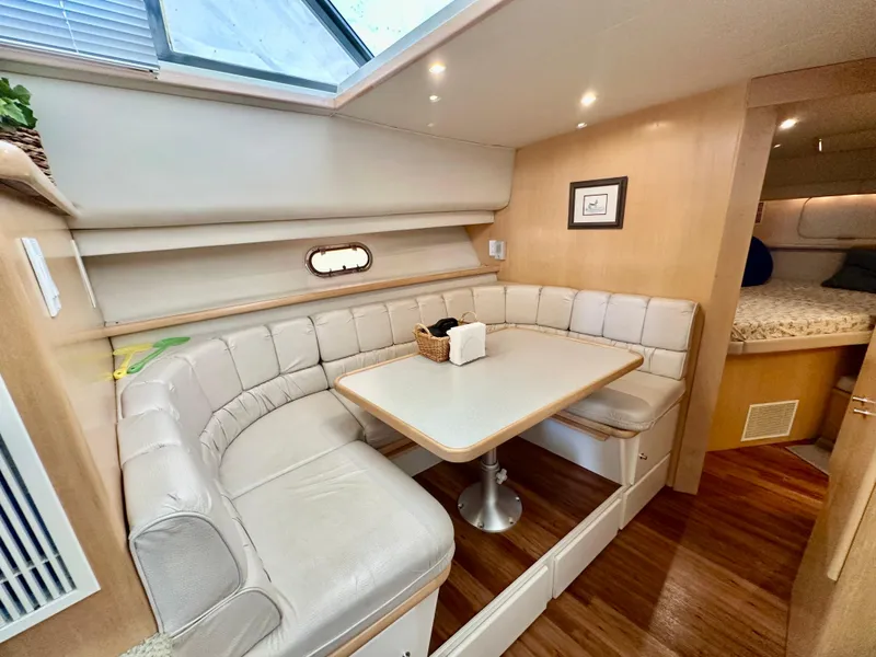 Slide: The Image of 1995 Carver 440 Aft Cabin Motor Yacht interior with vanity, lamp, and mirror. - 33