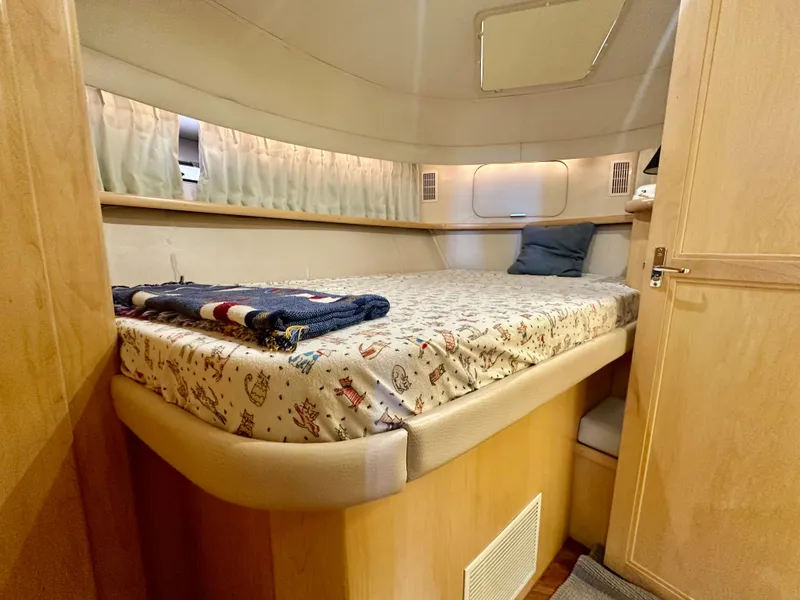 Slide: The Image of Interior of Carver 440 Aft Cabin Yacht, bedroom view. - 38