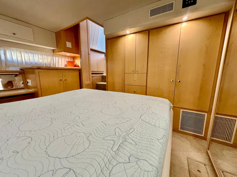 Slide: The Image of Engine room of 1995 Carver 440 Aft Cabin Motor Yacht, showcasing dual engines and mechanical components. - 47