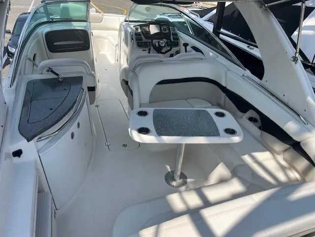 Slide: The Image of 2008 Chaparral SSX 276 boat interior with seating, table, and control panel. - 10
