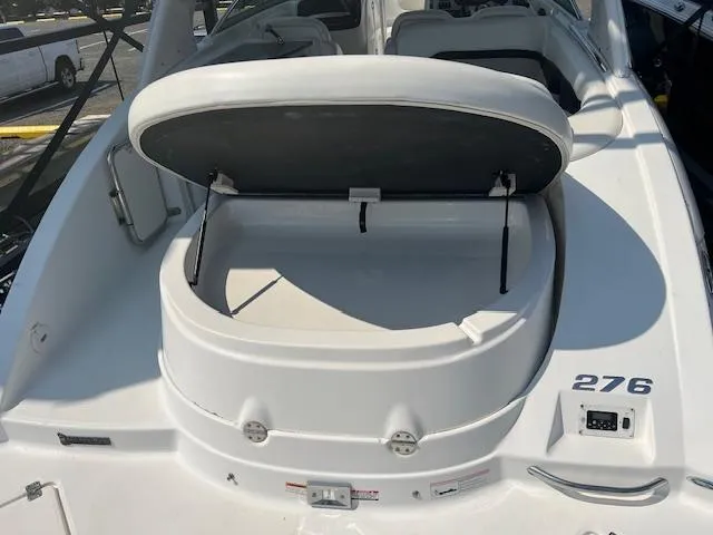 Slide: The Image of 2008 Chaparral SSX 276 boat with open storage compartment on deck. - 12