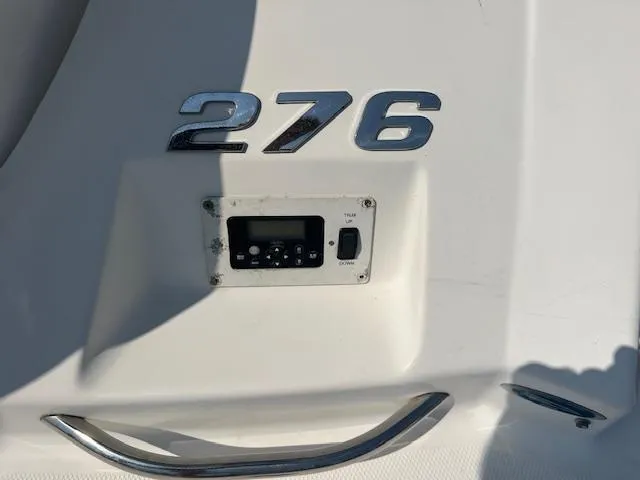 Slide: The Image of 2008 Chaparral SSX 276 boat dashboard with control panel and model number. - 13