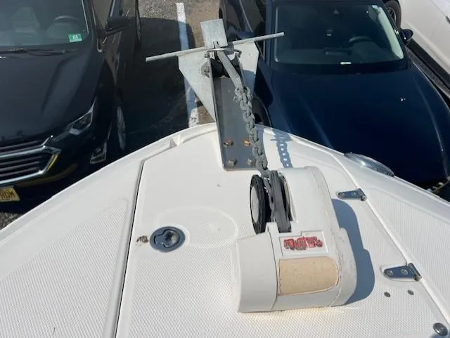 Slide: The Image of Bow of 2008 Chaparral SSX 276 with anchor system, parked near cars. - 16