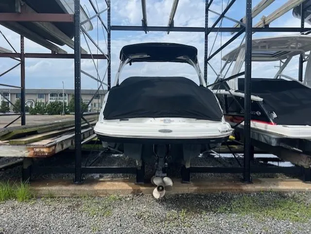 Slide: The Image of 2008 Chaparral SSX 276 boat stored on a rack, covered and secured. - 3