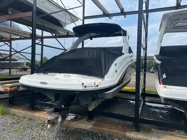 Slide: The Image of 2008 Chaparral SSX 276 boat stored on a rack, covered and ready for use. - 4