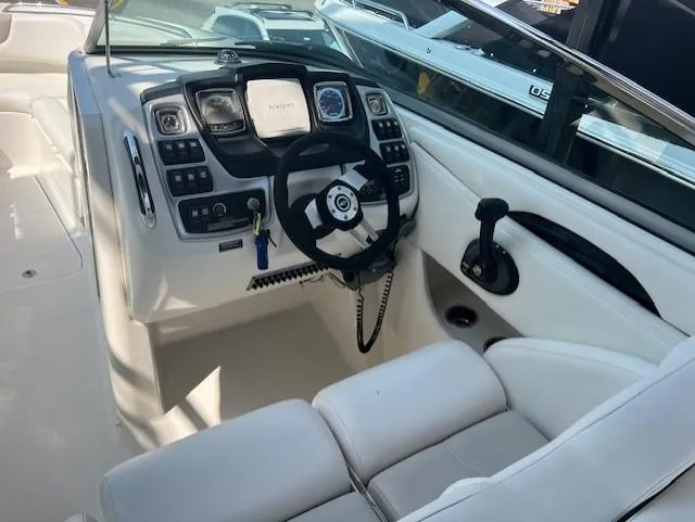 Slide: The Image of 2008 Chaparral SSX 276 boat cockpit with steering wheel and control panel. - 6