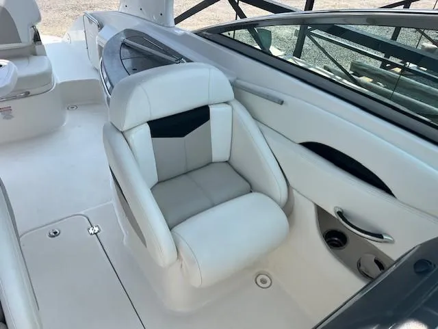 Slide: The Image of 2008 Chaparral SSX 276 boat interior with white seating and sleek design. - 8
