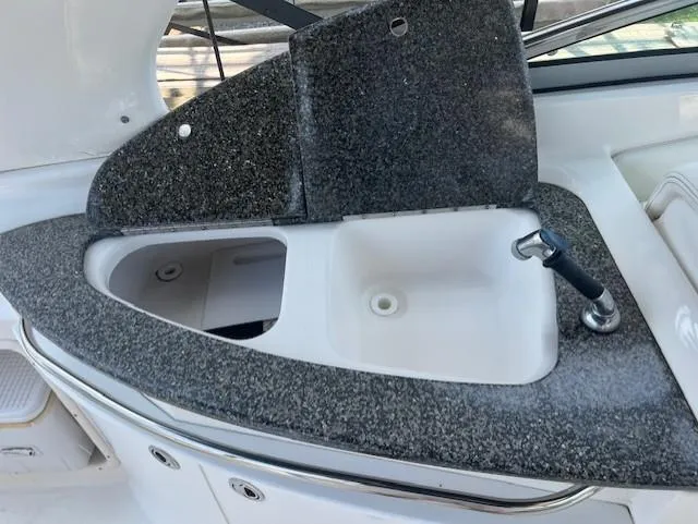 Slide: The Image of 2008 Chaparral SSX 276 boat sink with granite countertop. - 9