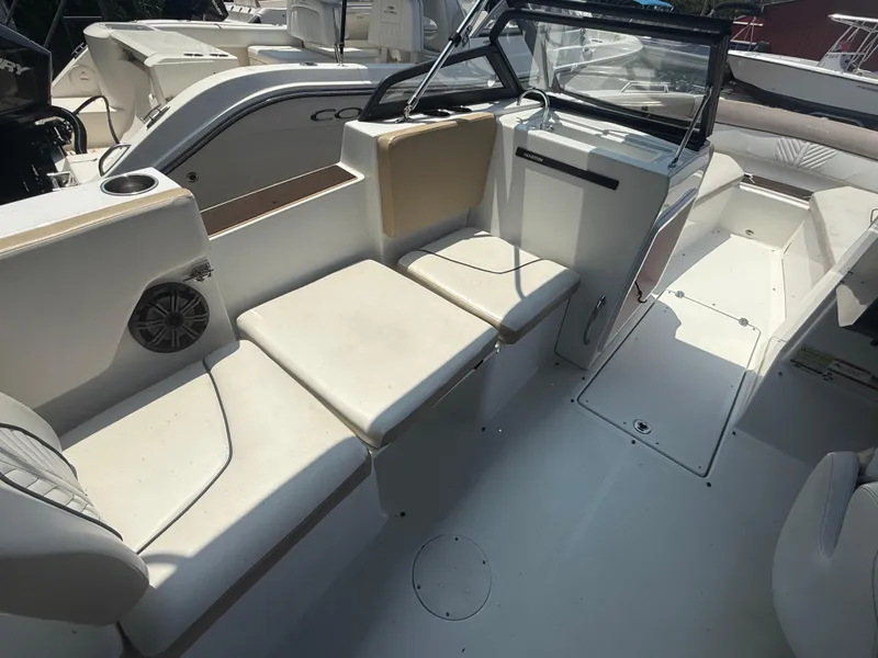 Slide: The Image of 2022 Glastron GTD 220 boat interior with white seating and modern design. - 11