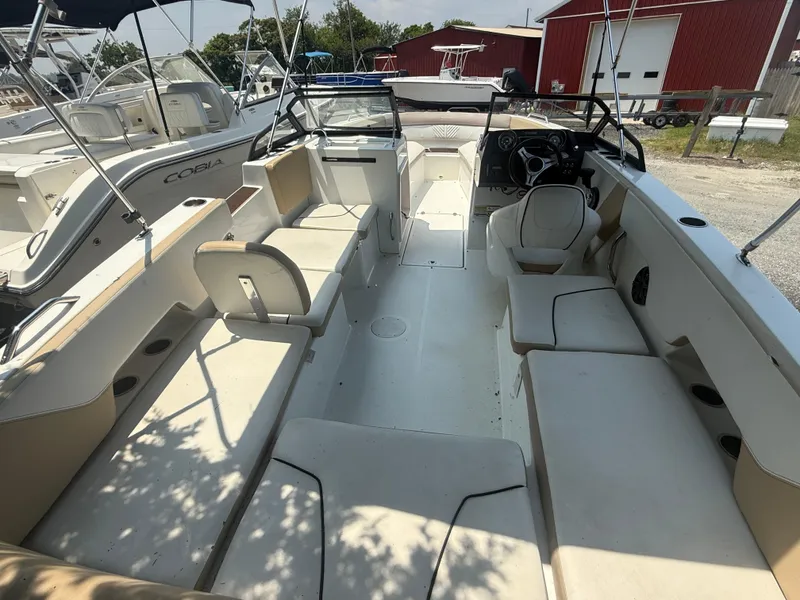 Slide: The Image of 2022 Glastron GTD 220 boat interior with spacious seating and modern design. - 13