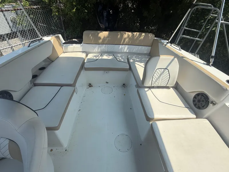 Slide: The Image of 2022 Glastron GTD 220 boat interior with spacious seating and modern design. - 9