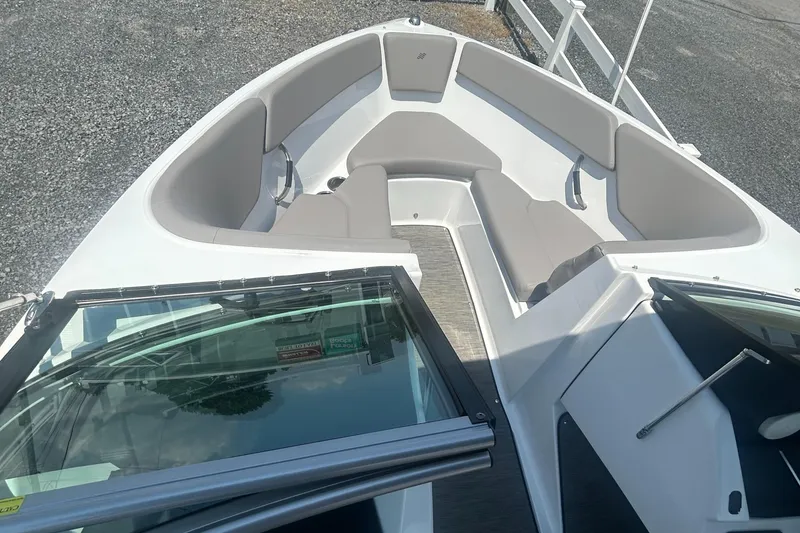 Slide: The Image of 2023 Four Winns H1 OB boat with spacious seating and sleek design. - 10