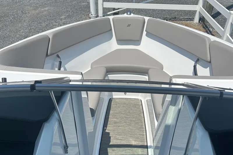 Slide: The Image of 2023 Four Winns H1 OB boat interior with gray seating and sleek design. - 11