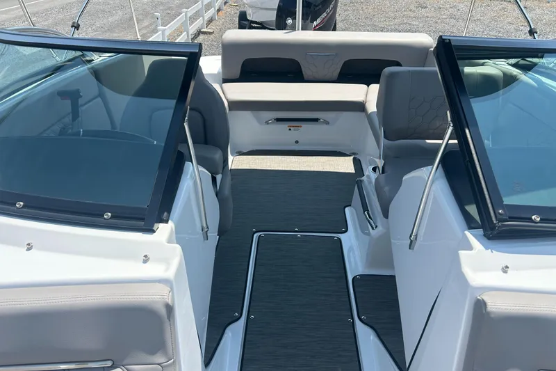 Slide: The Image of 2023 Four Winns H1 OB boat interior with seating and windshield. - 13