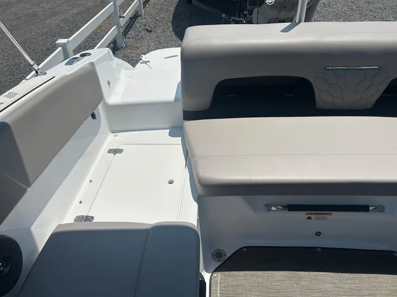 Slide: The Image of Interior view of 2023 Four Winns H1 OB boat, featuring sleek seating and modern design. - 21