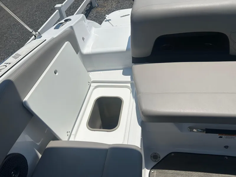 Slide: The Image of 2023 Four Winns H1 OB boat interior with seating and storage compartment. - 22