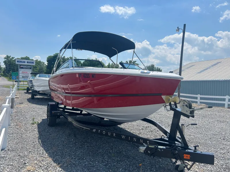 Slide: The Image of 2023 Four Winns H1 OB boat on trailer at Morgan Marine dealership. - 3