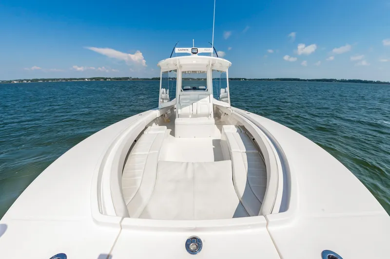 Slide: The Image of 2020 Regulator 34 Center Console boat on open water under clear blue sky. - 10