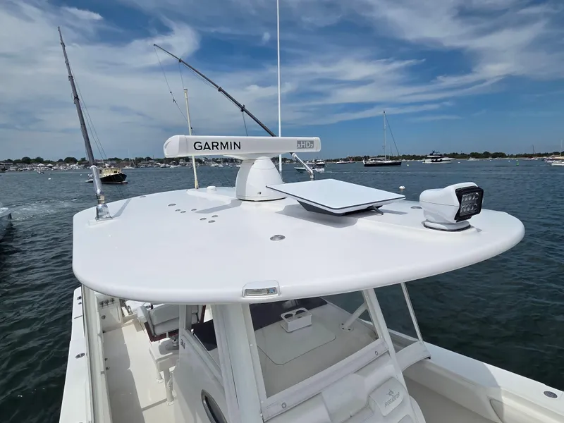 Slide: The Image of 2020 Regulator 34 Center Console boat with Garmin radar on open water. - 13