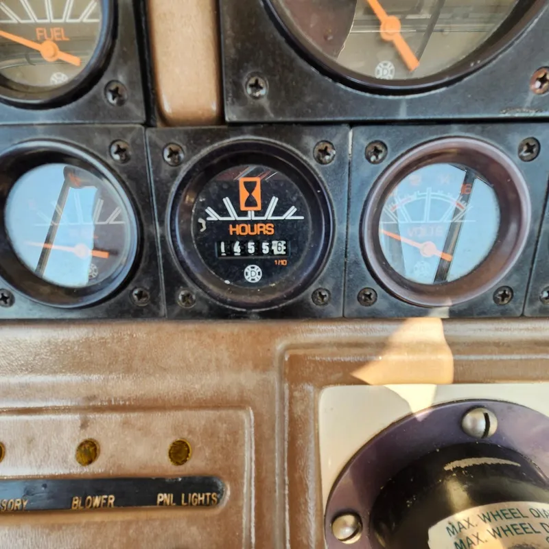 Slide: The Image of Dashboard of a 1989 Trojan F36 boat showing gauges and hour meter. - 19