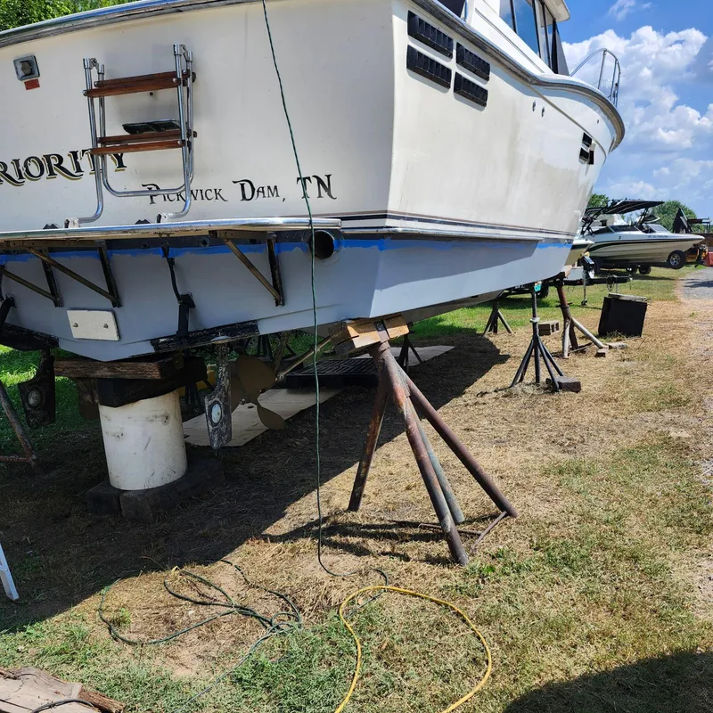 Slide: The Image of 1989 Trojan F36 boat on stands for maintenance at Pickwick Dam, TN. - 23