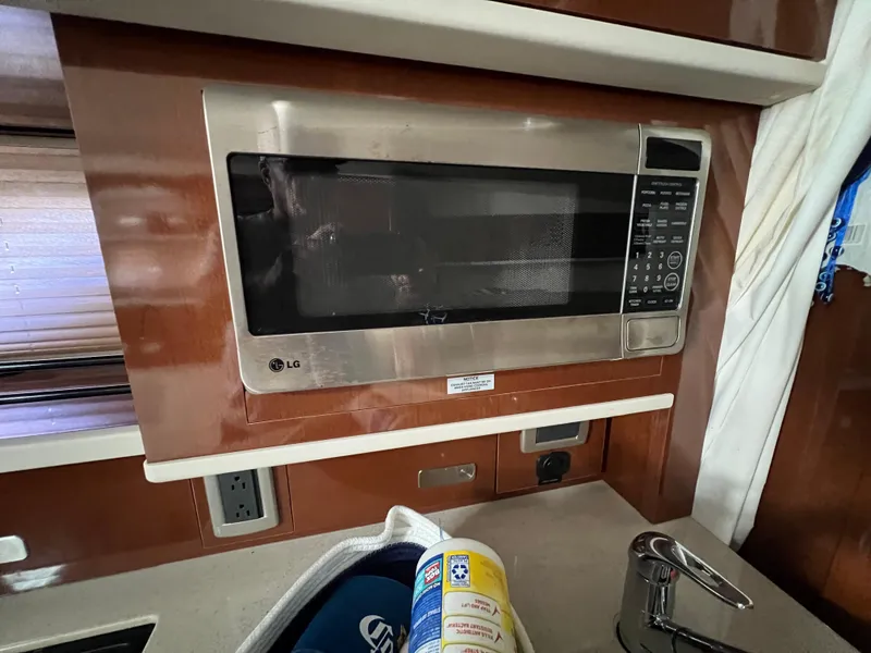 Slide: The Image of LG microwave in 2010 Sea Ray 330 Sundancer yacht kitchen interior. - 30