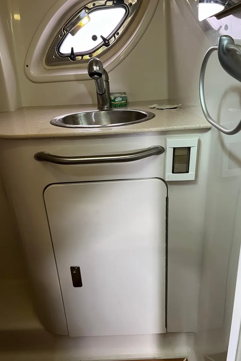 Slide: The Image of Compact sink area in 2010 Sea Ray 330 Sundancer boat interior. - 31