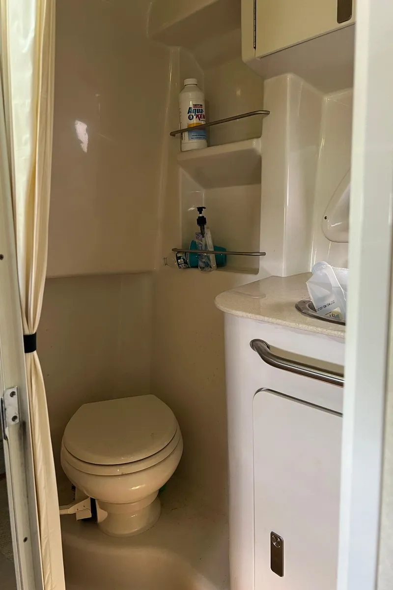 Slide: The Image of Bathroom interior of 2010 Sea Ray 330 Sundancer yacht with toilet and sink. - 32