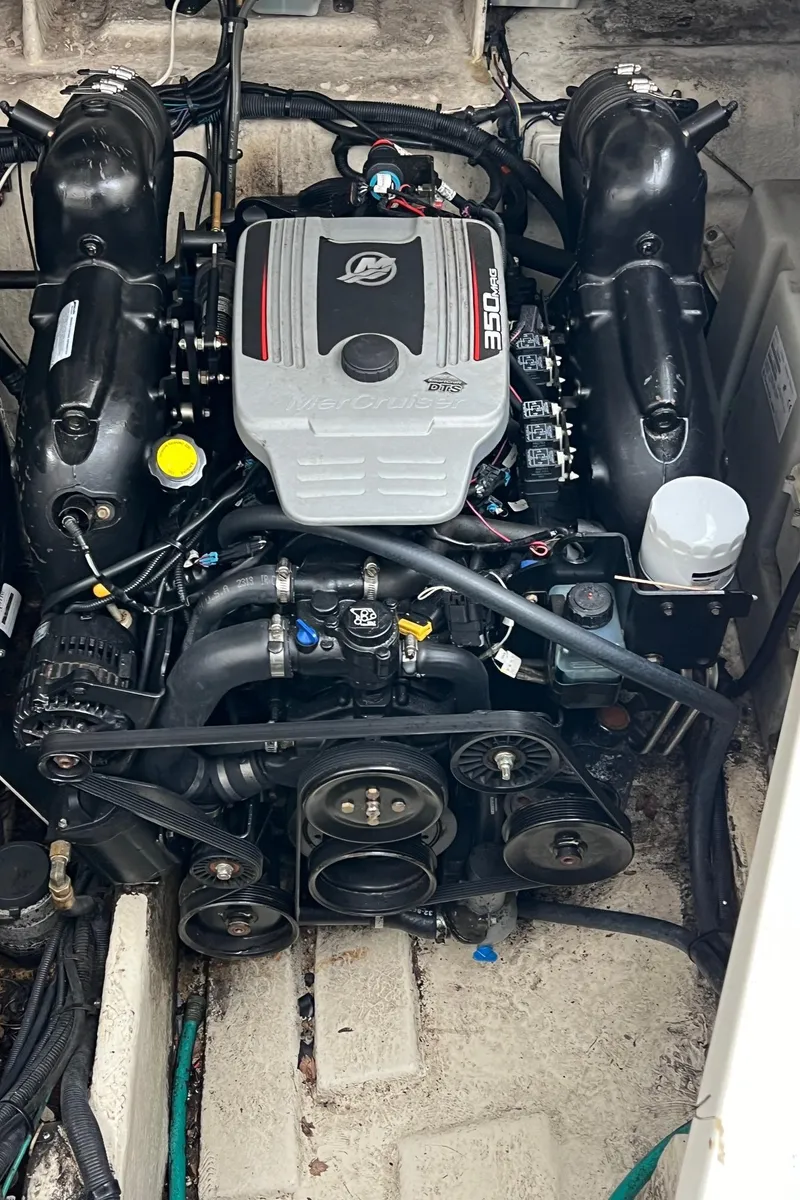 Slide: The Image of Engine compartment of a 2010 Sea Ray 330 Sundancer boat, featuring a MerCruiser 350 engine. - 33