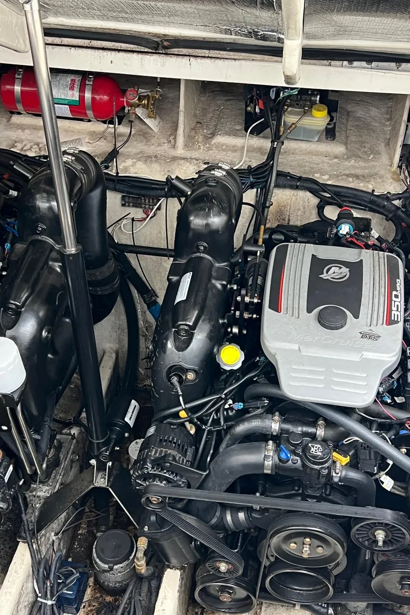 Slide: The Image of Engine compartment of a 2010 Sea Ray 330 Sundancer boat, featuring a MerCruiser 350 engine. - 34