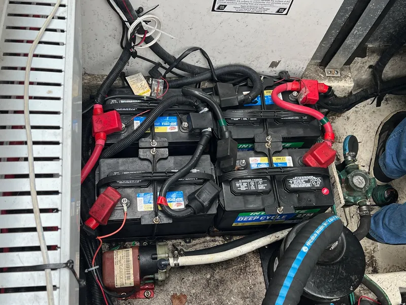 Slide: The Image of Battery compartment of a 2010 Sea Ray 330 Sundancer with multiple deep cycle batteries. - 35