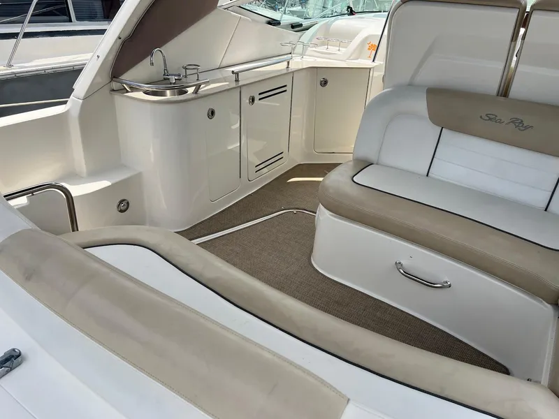 Slide: The Image of Interior of 2010 Sea Ray 330 Sundancer boat with seating and sink. - 8