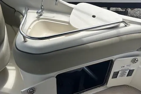 Slide: The Image of 2006 Sea Ray 240SD Bowrider interior with sink and storage compartment. - 10