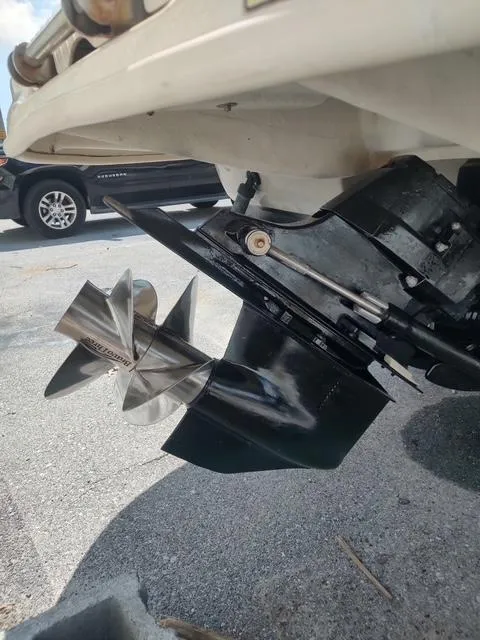 Slide: The Image of 2006 Sea Ray 240SD Bowrider boat propeller and stern drive on pavement. - 12