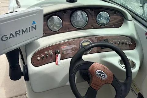 Slide: The Image of Dashboard of a 2006 Sea Ray 240SD Bowrider with Garmin navigation system. - 5