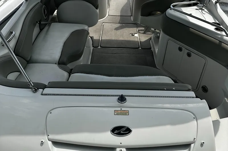 Slide: The Image of 2006 Sea Ray 240SD Bowrider interior with seating and storage compartments. - 6