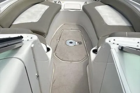 Slide: The Image of 2006 Sea Ray 240SD Bowrider interior with seating and storage compartments. - 8