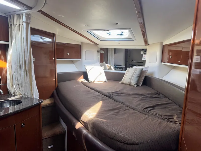 Slide: The Image of Luxurious interior cabin of 2014 Sea Ray 330 Sundancer yacht with cozy bedding. - 21