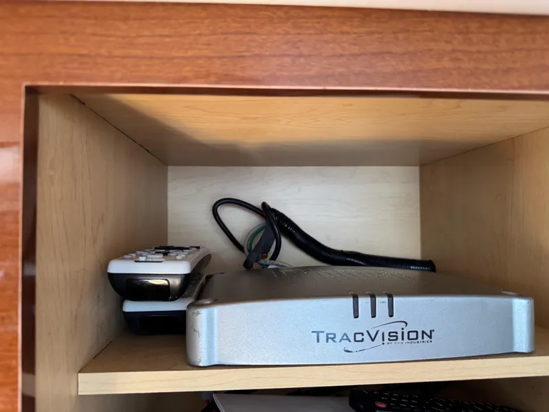 Slide: The Image of TracVision satellite receiver and remotes in a Sea Ray 330 Sundancer, 2014 model. - 37