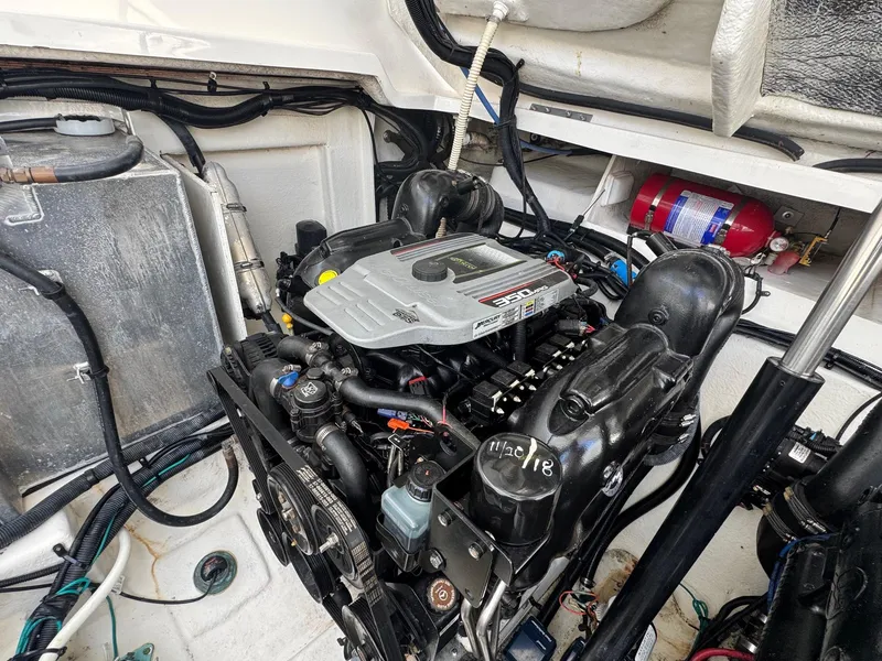 Slide: The Image of Engine compartment of a 2014 Sea Ray 330 Sundancer with visible components and fire extinguisher. - 38