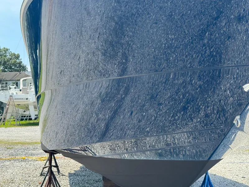 Slide: The Image of 2014 Sea Ray 330 Sundancer boat hull on dry dock, reflecting surroundings. - 6