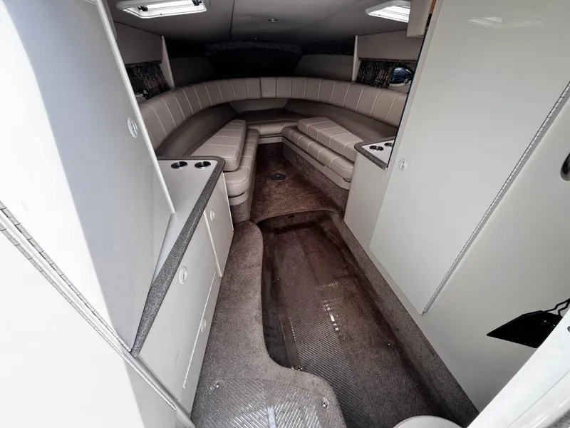 Slide: The Image of 1999 Formula 33 SS boat interior with spacious seating and modern amenities. - 16