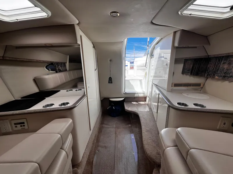 Slide: The Image of 1999 Formula 33 SS boat interior with seating, countertops, and skylights. - 20