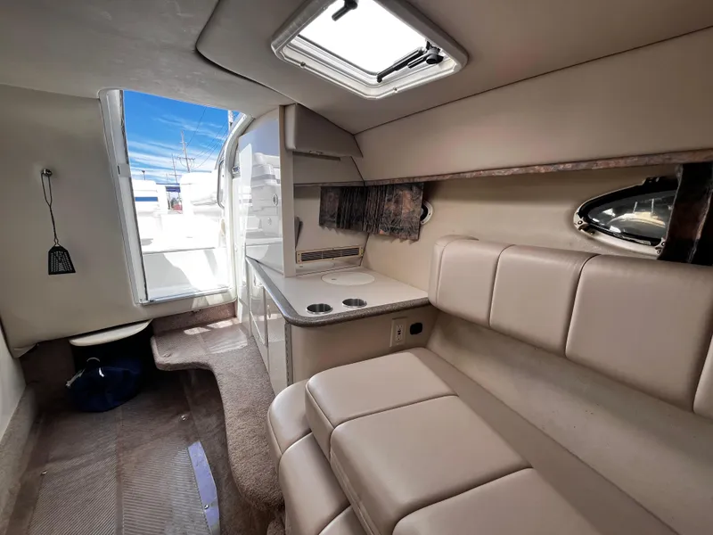 Slide: The Image of Interior of a 1999 Formula 33 SS boat with seating and kitchenette. - 21