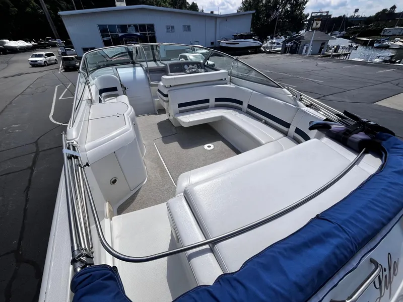 Slide: The Image of 1999 Formula 33 SS boat with spacious seating, docked at a marina. - 7