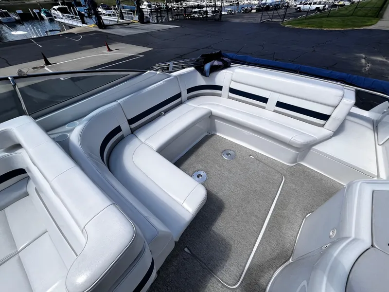 Slide: The Image of 1999 Formula 33 SS boat interior with white seating and gray carpet. - 8