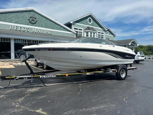 The Image of Chaparral 196 SSi 2002 boat on trailer at Reeds Marine dealership. - 0