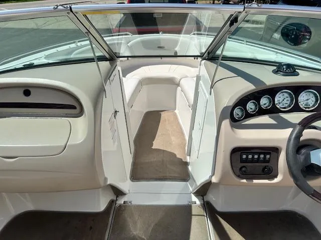 Slide: The Image of Interior view of a 2002 Chaparral 196 SSi boat, featuring dashboard and seating area. - 10